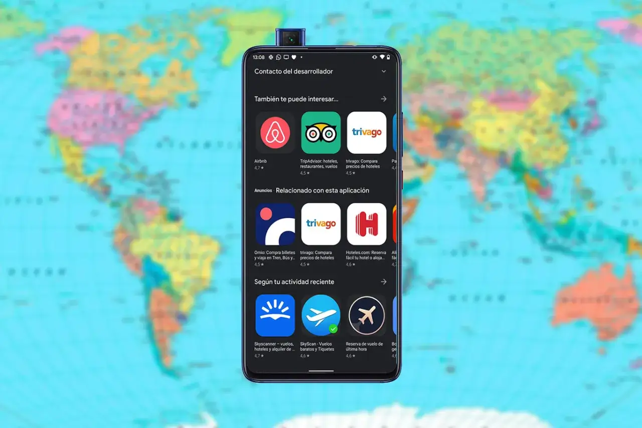 Tel&eacute;fono mostrando apps de viajes como Airbnb, TripAdvisor y Trivago, con un mapa del mundo de fondo.